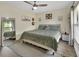 Light-filled main bedroom with neutral tones, ceiling fan, and stylish décor at 1382 Coronet Dr, Deltona, FL 32725