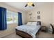 Cozy bedroom with a ceiling fan, soft carpet, natural light and simple decor for a peaceful retreat at 140 Limewood Pl # C, Ormond Beach, FL 32174