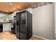 Bright kitchen featuring a modern, stainless steel refrigerator and sleek, white cabinetry at 140 Limewood Pl # C, Ormond Beach, FL 32174