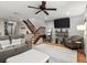 Inviting living room featuring a modern decor, plush seating, a staircase and accent home decor at 140 Limewood Pl # C, Ormond Beach, FL 32174