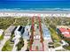 Aerial view of home and property with its beach access at 1421 N Atlantic Ave, New Smyrna Beach, FL 32169