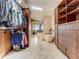 Modern walk-in closet into a luxurious bathroom with soaking tub and skylight at 1421 N Atlantic Ave, New Smyrna Beach, FL 32169
