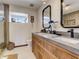 Modern bathroom with a double sink vanity, sleek fixtures, and a neutral color palette at 1421 N Atlantic Ave, New Smyrna Beach, FL 32169