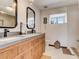 Stylish bathroom featuring a double vanity with a concrete countertop, modern fixtures, and a bright, airy feel at 1421 N Atlantic Ave, New Smyrna Beach, FL 32169