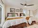 Charming bedroom with two twin beds, terracotta tile floors, and ample natural light at 1421 N Atlantic Ave, New Smyrna Beach, FL 32169