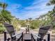 Inviting deck with beach access and seating, perfect for enjoying the coastal view at 1421 N Atlantic Ave, New Smyrna Beach, FL 32169