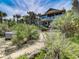 Beautiful home with lush landscaping, hot tub, and nearby beach access at 1421 N Atlantic Ave, New Smyrna Beach, FL 32169