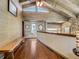 Entryway features wood-paneled walls, bench seating, and natural light from the sidelight window at 1421 N Atlantic Ave, New Smyrna Beach, FL 32169
