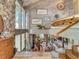 Stunning foyer showcasing stone accents, modern decor, wood details, and natural light from large windows at 1421 N Atlantic Ave, New Smyrna Beach, FL 32169