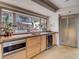 Kitchen area features modern appliances, storage, counter space, and an oversized window at 1421 N Atlantic Ave, New Smyrna Beach, FL 32169