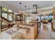 A spacious kitchen island overlooks an open-concept living space and staircase at 1421 N Atlantic Ave, New Smyrna Beach, FL 32169