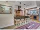 Stylish kitchen featuring a large island with seating and modern pendant lighting fixtures above at 1421 N Atlantic Ave, New Smyrna Beach, FL 32169