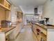 Spacious kitchen with sleek, light wood cabinetry, concrete countertops, and stainless steel appliances at 1421 N Atlantic Ave, New Smyrna Beach, FL 32169