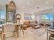 Bright living room with stylish furniture, neutral color palette and balcony access showcasing relaxing space at 1421 N Atlantic Ave, New Smyrna Beach, FL 32169