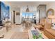 Inviting living room with a kitchen view, dining area, and cozy seating arrangement at 1421 N Atlantic Ave, New Smyrna Beach, FL 32169