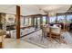 Stylish living space with fireplace, seating area, and large wooden dining table at 1421 N Atlantic Ave, New Smyrna Beach, FL 32169