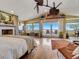 Spacious main bedroom featuring fireplace, access to the balcony with stunning views at 1421 N Atlantic Ave, New Smyrna Beach, FL 32169