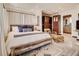 Spacious main bedroom with a king bed, walk-in closet, and an en-suite bathroom at 1421 N Atlantic Ave, New Smyrna Beach, FL 32169