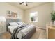 Bright bedroom featuring modern decor, neutral tones, and ample natural light at 150 Portofino Blvd, New Smyrna Beach, FL 32168