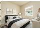 Cozy bedroom with neutral tones, modern decor, and ample natural light at 150 Portofino Blvd, New Smyrna Beach, FL 32168