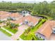 Exterior view of the house, showcasing its well-manicured landscaping and serene pond views at 150 Portofino Blvd, New Smyrna Beach, FL 32168
