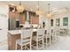 Spacious kitchen featuring a large island with seating, stainless steel appliances, and pendant lighting at 150 Portofino Blvd, New Smyrna Beach, FL 32168