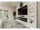 Living room offers recessed lighting, modern fireplace, decorative built-ins, and a plush sectional sofa at 150 Portofino Blvd, New Smyrna Beach, FL 32168