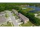 Aerial view of residential townhomes with lush landscaping and lakes, showcasing the desirable neighborhood and community at 1615 Primo Ct, Holly Hill, FL 32117