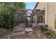 View of backyard featuring a screened patio, air conditioning unit, lush greenery, and access to indoor living spaces at 1615 Primo Ct, Holly Hill, FL 32117