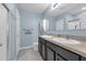 Bathroom featuring double sinks, vanity with granite countertop, and ample lighting at 1615 Primo Ct, Holly Hill, FL 32117