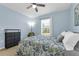Comfortable bedroom featuring carpet, natural light from a window, and a ceiling fan at 1615 Primo Ct, Holly Hill, FL 32117