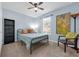 Bedroom featuring light blue paint, natural light from a window, carpet, and ceiling fan at 1615 Primo Ct, Holly Hill, FL 32117