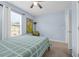 Bedroom featuring light blue paint, natural light from a window, carpet, and ceiling fan at 1615 Primo Ct, Holly Hill, FL 32117