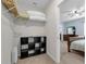 Walk-in closet offering shelving for organized storage, leading to bedroom and ensuite at 1615 Primo Ct, Holly Hill, FL 32117