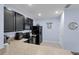 The kitchen features modern appliances and granite countertops, blending style and functionality for a superior cooking experience at 1615 Primo Ct, Holly Hill, FL 32117