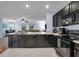An inviting kitchen opens to the living area, enhancing the home's appeal with its modern design and convenient layout at 1615 Primo Ct, Holly Hill, FL 32117
