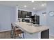 The kitchen features granite countertops and modern appliances, combining style and functionality for a delightful cooking experience at 1615 Primo Ct, Holly Hill, FL 32117