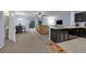 Open concept living space includes living and dining area in view of kitchen, promoting an inclusive living experience at 1615 Primo Ct, Holly Hill, FL 32117