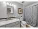 Neutral bathroom with gray vanity, grey countertop, and patterned shower curtain at 167 N Hill Ave # 60, Deland, FL 32724