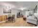 Spacious living room with a dining area, wood floors, and natural light at 167 N Hill Ave # 60, Deland, FL 32724