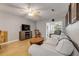 Cozy living room featuring wood floors, comfortable furnishings, and natural light at 167 N Hill Ave # 60, Deland, FL 32724