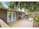 Backyard boasts a wood deck, grill, and lush tropical landscaping at 1723 Needle Palm Dr, Edgewater, FL 32132