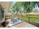 Private backyard with a wooden deck, patio furniture and a grill for entertaining at 1723 Needle Palm Dr, Edgewater, FL 32132