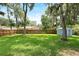 Expansive backyard features a shed and lush green lawn at 1723 Needle Palm Dr, Edgewater, FL 32132