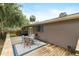 Charming backyard includes a wood deck, patio, and lush landscaping at 1723 Needle Palm Dr, Edgewater, FL 32132
