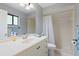 Clean bathroom with a vanity, shower-tub combo, and neutral finishes at 1723 Needle Palm Dr, Edgewater, FL 32132