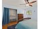Comfortable bedroom with a large closet, a wooden dresser, and a window offering natural light at 1723 Needle Palm Dr, Edgewater, FL 32132