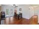 Bright dining area adjacent to the kitchen, featuring hardwood floors and patio access at 1723 Needle Palm Dr, Edgewater, FL 32132