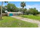 Quaint single-Gathering home with a well-kept lawn and a private driveway at 1723 Needle Palm Dr, Edgewater, FL 32132