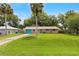 Charming single-story home featuring a well-maintained lawn and brick accents at 1723 Needle Palm Dr, Edgewater, FL 32132